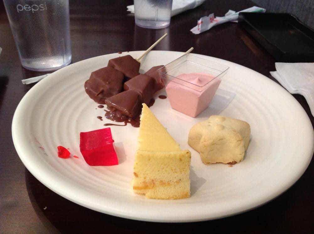 Dessert of fondue fruit, strawberry mousse, pineapple star