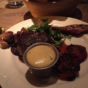 Bavette's Bar & Boeuf - Chicago, IL, United States. Petite Filet with roasted tomatoes and sides of bacon and mushrooms