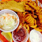 Tarks Of Dania Beach - Dania Beach, FL, United States. Fried seafood sampler: clams, shrimp, and grouper. Tartar sauce and cocktail sauce. Coleslaw. Seasoned curly fries. $8.95.