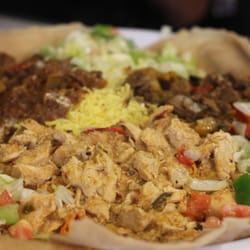 Afro-Canadian Restaurant - Vancouver, BC, Canada. Meat combo: chicken, beef, lamb