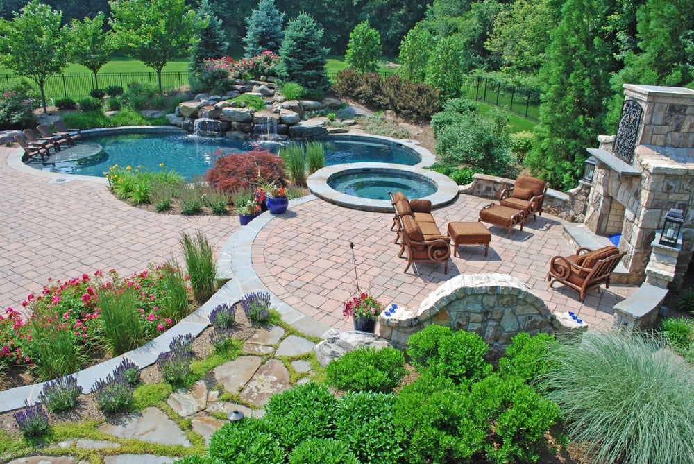 A Backyard Retreat Pool Paver Patio Waterfall And Landscaping Photo Of Kane Landscapes Sterling Va United States A Backyard Retreat