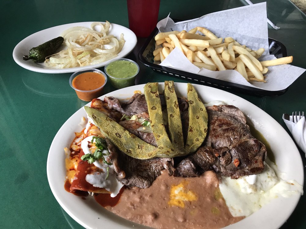 Outstanding beef steak with sautéed onions, two chicken ...
