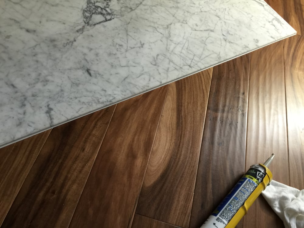 Natural Acacia Engineered Wood On A Angled Cut Against Marble Yelp Photo Of Carpet Surplus And Hardwood Liquidators Norcross Ga United States Natural