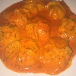 Photo of Woodside Cafe - Woodside, NY, United States. Pink cream sauce momo is life!