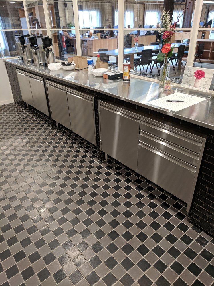 Stainless Cabinets With Swing Doors And Drawers And A Counter Top