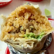 El Farolito - San Francisco, CA, United States. Super Burrito with chicken. Comes with sour cream and guac.