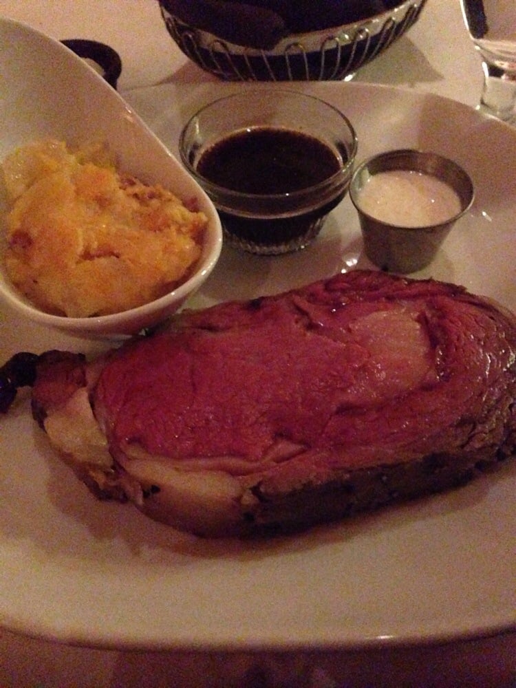 Photo of Waverly's Steak House - North Las Vegas, NV, United States. 16oz Prime rib with au jus and whipped horseradish cream. Bacon au gratin potato comes with.