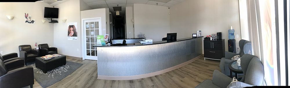 image of business Adam Dental Care