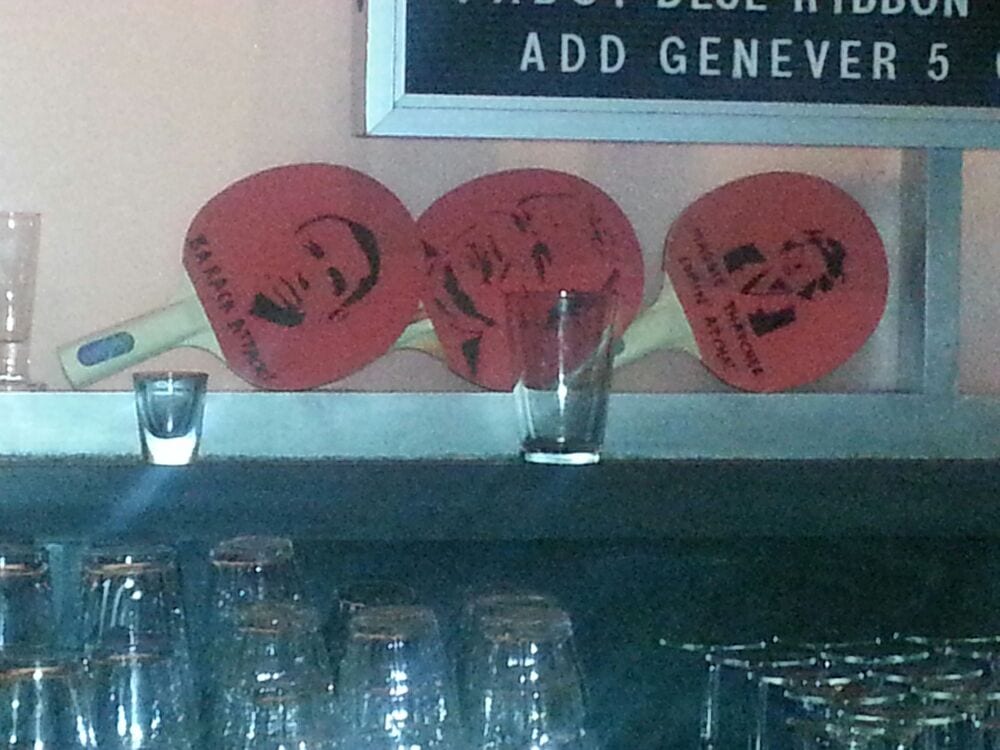 Photo of Comet Ping Pong - Washington, DC, United States. Can you guess who the middle paddle is?