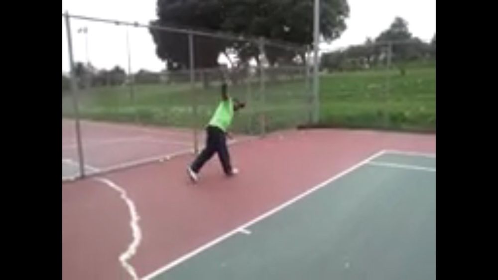 Photo of Tennis Lessons By Mcclain - San Francisco, CA, United States. The follow through is complete, this is how you should look after finishing your single backhand follow through Full extension