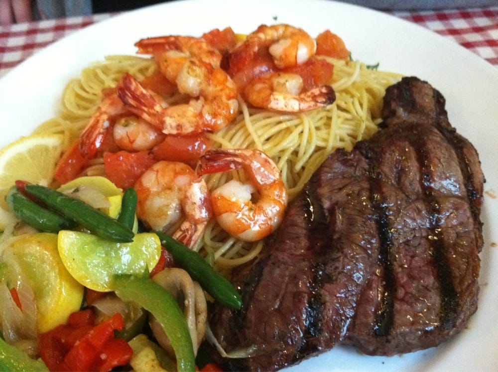 Steak and shrimp with in season veg, and spaghetti with garlic and