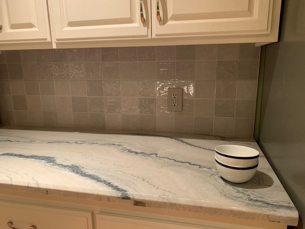 Closer Picture Of Quartz Countertop And Tile Backsplash In