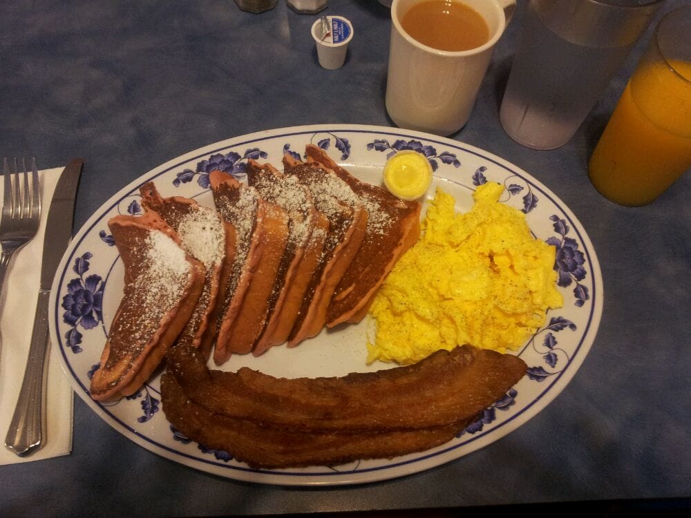 Boysenberry french toast with scrambled eggs and bacon Yelp