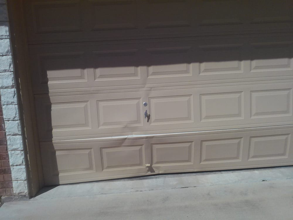 Outside View Of A Garage Door That Had Been Backed Into After The Photo Of Payless Garage Doors Killeen Tx United States Outside View