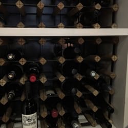 Photo of Fix Wine Bar + Restaurant - Sydney New South Wales, Australia. Lots of wine cover the back wall of the restaurant :)