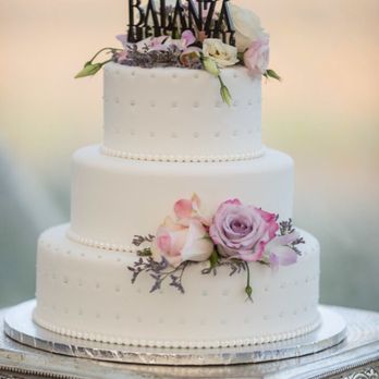 My simple 3,tier white fondant wedding cake with some blush