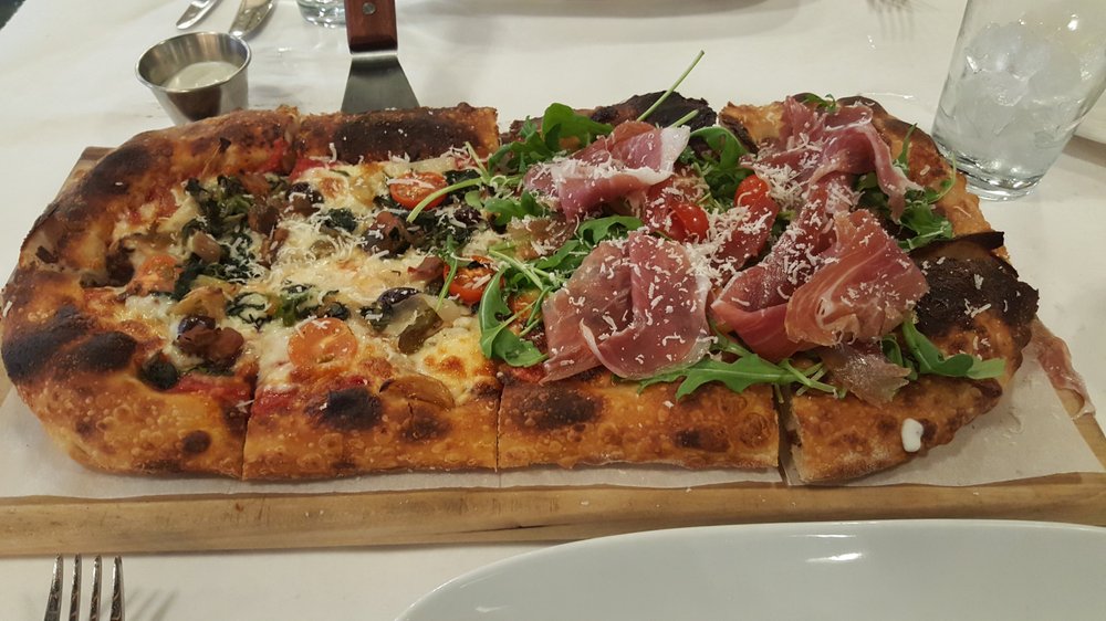 Photo of Pizzeria Monzú - Las Vegas, NV, United States. small pizza - 1/2 Vegetariana and 1/2 Vegas Meets Italy