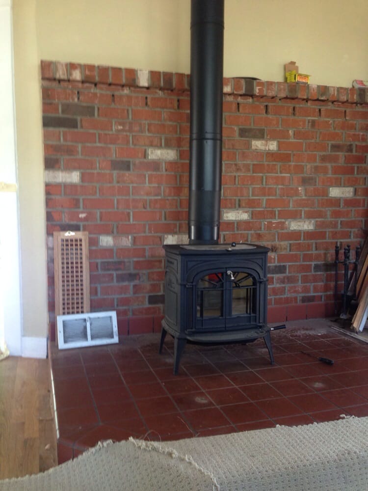 Vermont Castings free standing Woodstove installed with New dura-tech double wall black stove pipe and triple insulated Chimney. - Yelp Photo of Portland Fireplace And Chimney - "Vermont Castings free standing Woodstove installed with New dura-tech double wall black stove pipe and triple insulated Chimney." - Portland