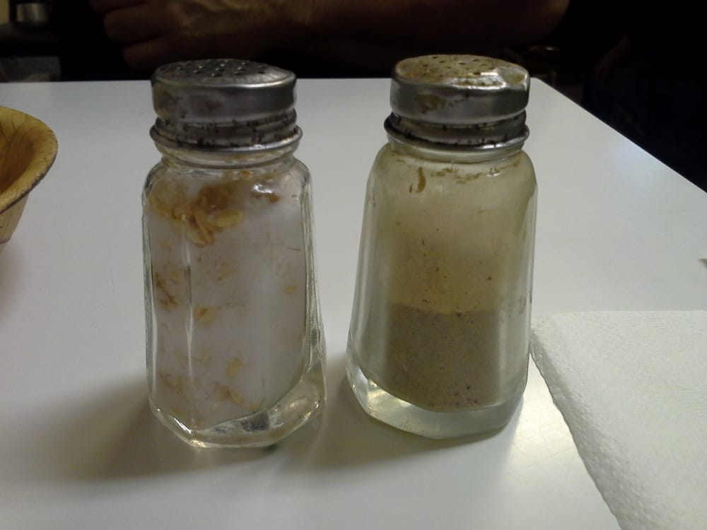 Old style salt and pepper shakers. Check out the rice in the salt