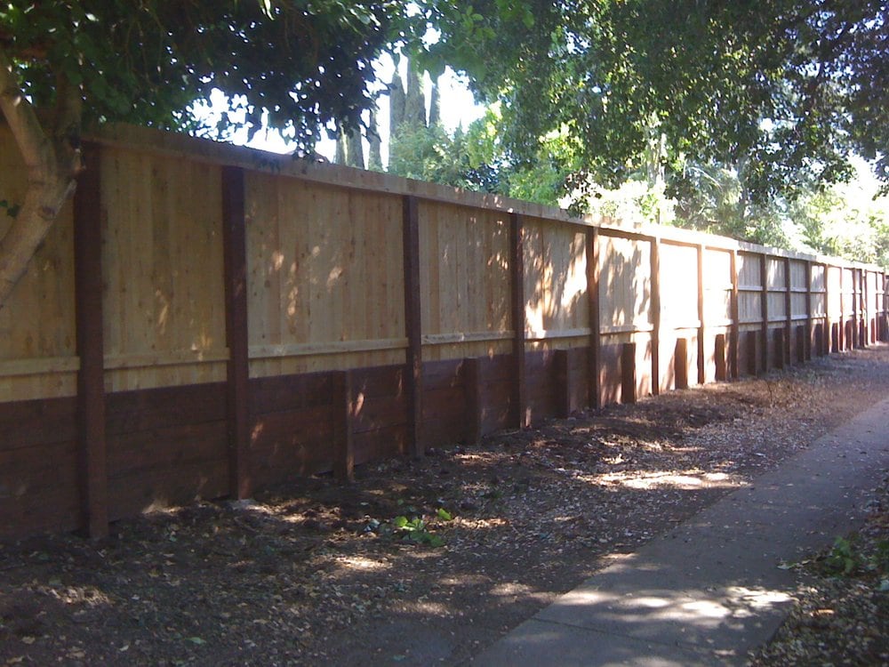 Standard board fence on top of retaining wall  Incense cedar  Yelp
