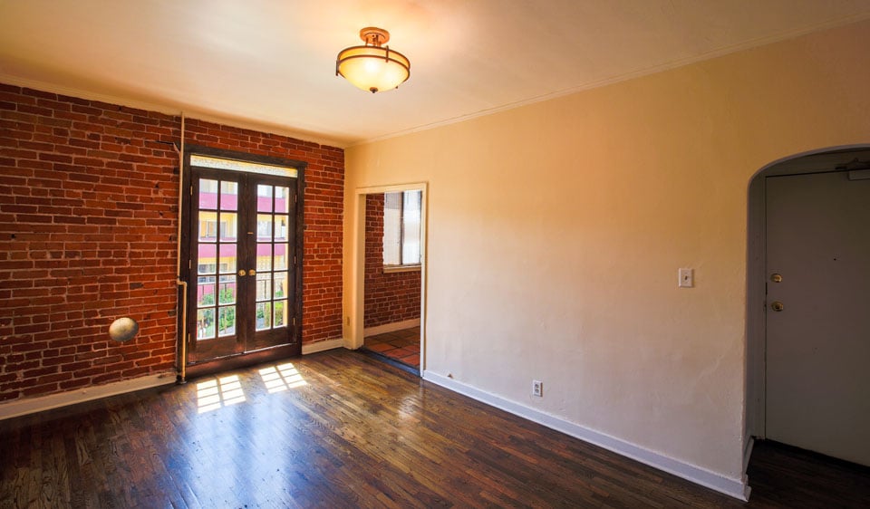 Plaza Cordova Living Room With Hardwood Floors Exposed Brick Photo Of Plaza Cordova Los Angeles Ca United States