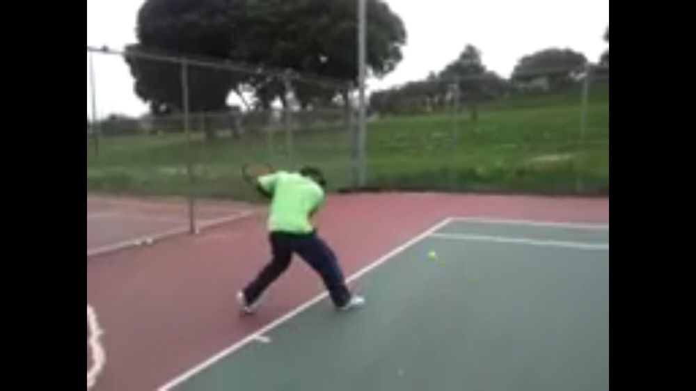Photo of Tennis Lessons By Mcclain - San Francisco, CA, United States. Racket is back on single backhand knees are bent Ready to extend arm out to get a complete follow through