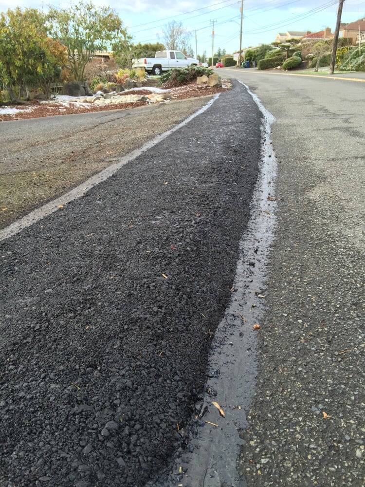 Driveway curb to keep water out of yard. - Yelp