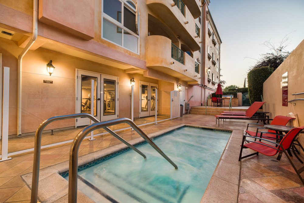 Swimming Pool Surrounded By Lounge Chairs Yelp