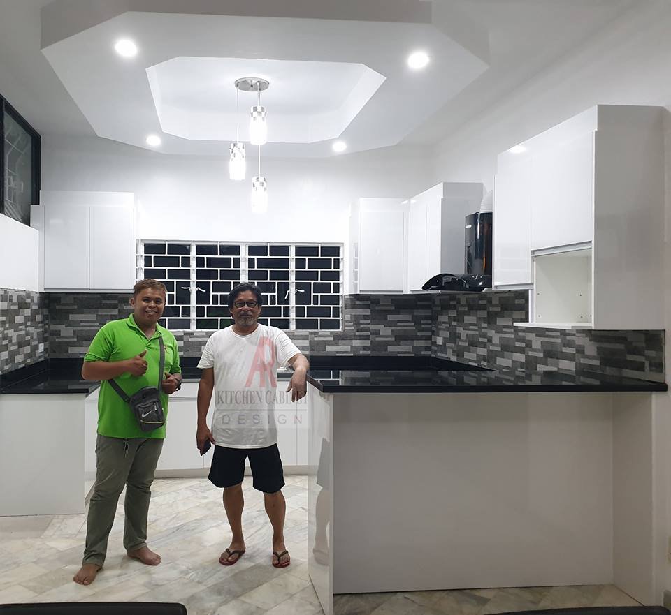 Glossy White Kitchen With Black Galaxy Countertop In Lapu