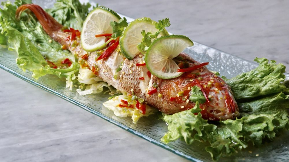 Photo of Kitchen 79 - Jackson Heights, NY, United States. PLA NEUNG MA NAO : Â  Â  Â  Â  Â  Steamed Whole Fish Topped with Thai Hot & Spicy Lime Dressing