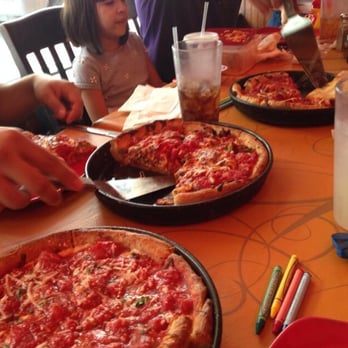 We Owe it All to a Man and his Pan Uno Chicago Grill is a casual dining establishment in Chicago. The restaurant is large, bright and has a laid-back and casual atmosphere. It is filled with comfortable .