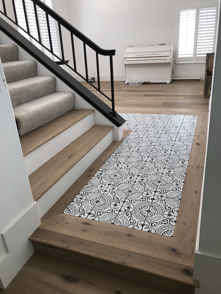 Front Foyer With Custom Tile Inlay And First 2 Steps Changed To Wood