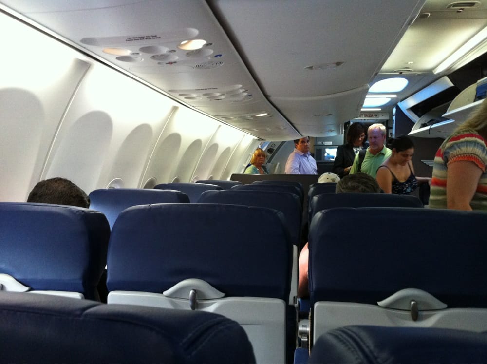 New Southwest plane interior with strange overhead bins.. Yelp